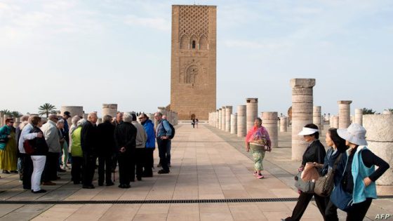 Tourists visit the Hassan Tower in Rabat on February 22, 2017.
Morocco's key tourism sector barely grew last year amid security challenges, but operators are hoping Chinese and Russian visitors will boost their fortunes in the coming years. / AFP PHOTO / FADEL SENNA