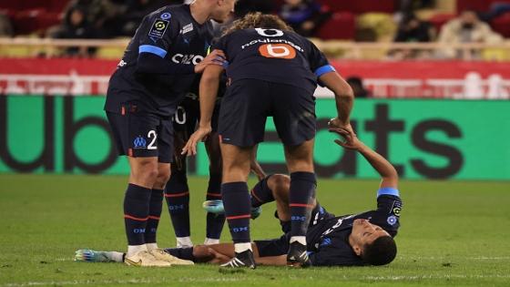 Marseille's Moroccan midfielder Amine Harit reacts in pain after suffering an injury during the French L1 football match between AS Monaco and Olympique de Marseille at the Louis II Stadium (Stade Louis II) in the Principality of Monaco on November 13, 2022. (Photo by Valery HACHE / AFP) (Photo by VALERY HACHE/AFP via Getty Images)