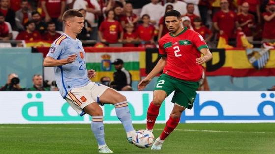 Spain's forward #21 Dani Olmo fights for the ball with Morocco's defender #02 Achraf Hakimi during the Qatar 2022 World Cup round of 16 football match between Morocco and Spain at the Education City Stadium in Al-Rayyan, west of Doha on December 6, 2022. (Photo by JACK GUEZ / AFP)