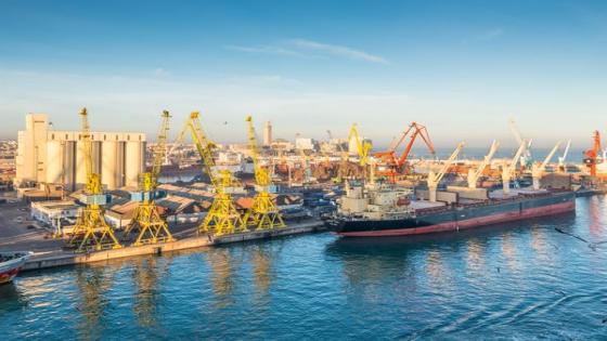 Cargo vessel Ocean Luck (Bulk Carrier) early in the morning in the seaport of Casablanca, Morocco. The scene with harbor cranes, elevators, ships and export cargoes in the port.