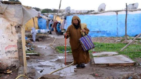 TO GO WITH AFP STORY BY GUILLAUME KLEIN
A Moroccan man walks along a dirty street in the Sahb al-Kaid shanty town in Sale, northwestern Morocco, on the right bank of the Bou Regreg river, opposite the national capital Rabat, for which it serves as a commuter town, on November 28, 2012. If the sea is never far, it is the ocean of tarpaulins and sheet steel that suddenly hits our eyes. Under the autumnal sky, residents of Sahb al-Kaid are still waiting to be relocated. AFP PHOTO/FADEL SENNA (Photo by FADEL SENNA / AFP)